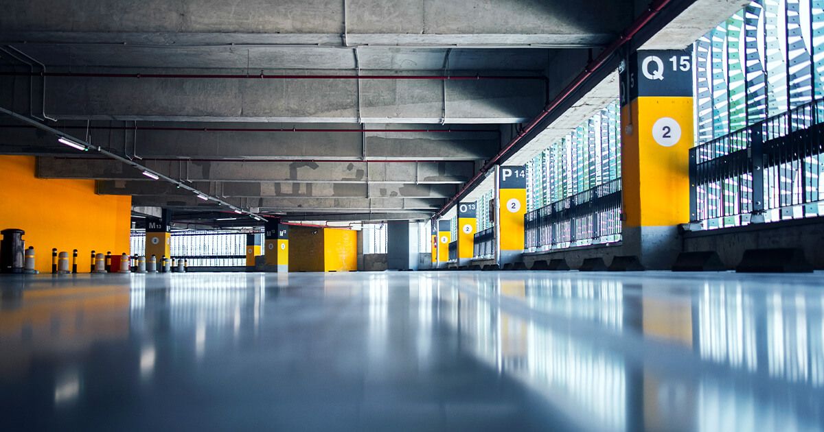 Empty parking garage with yellow walls.