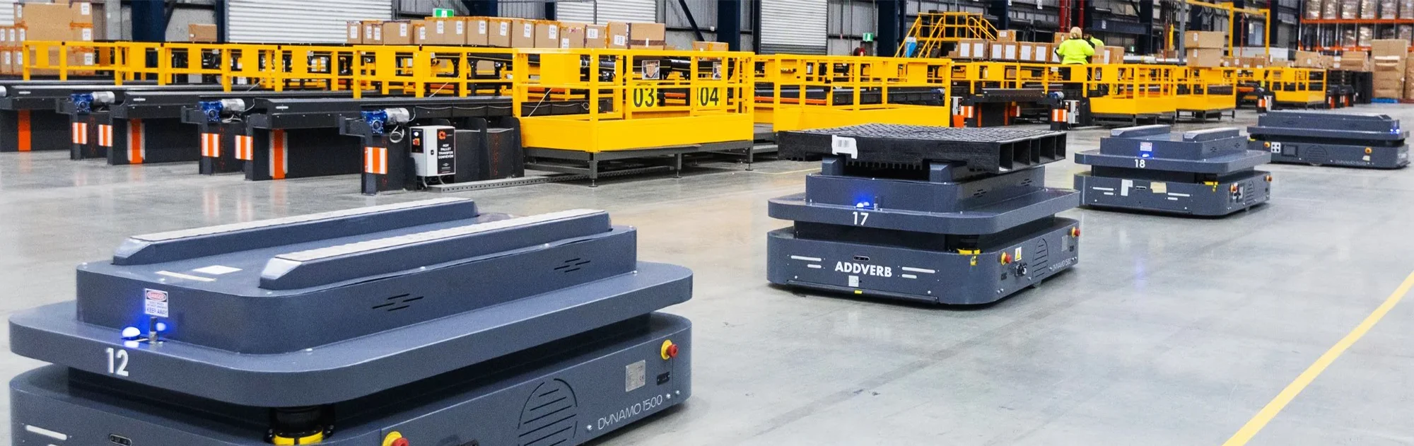 Addverb autonomous mobile robots transporting goods in a warehouse.
