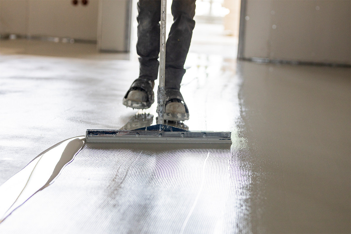 close up of person installing concrete floor
