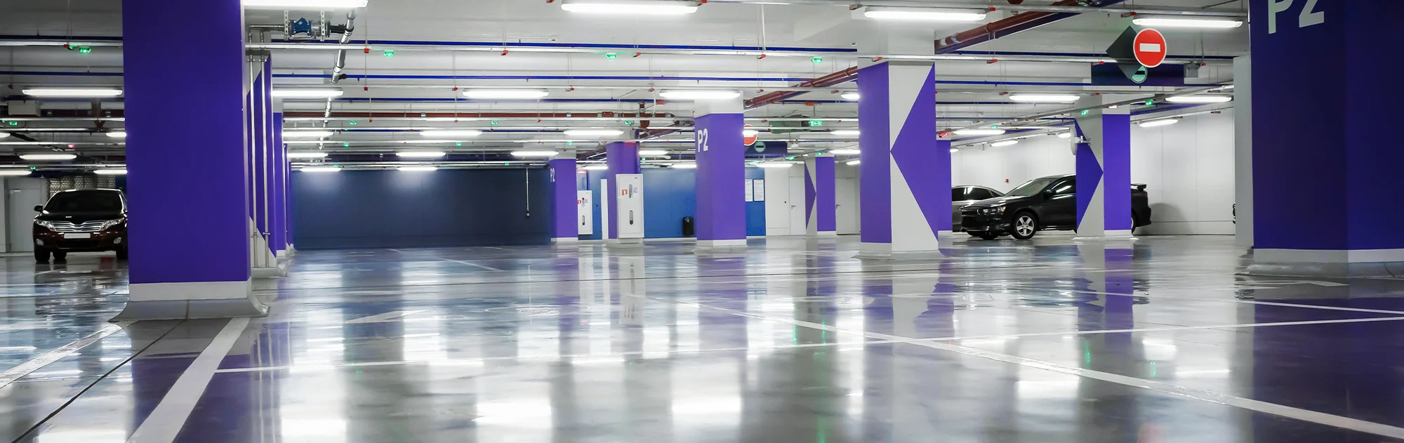 Parking garage flooring with purple beams